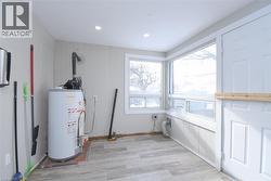Utility room featuring gas water heater - 