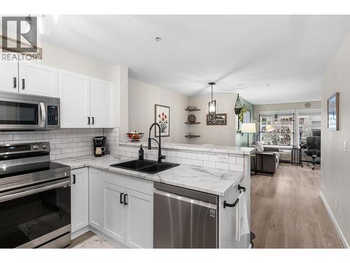Freshly renovated kitchen with stainless appliances - 567 Yates Road Unit# 204, Kelowna, BC - Indoor Photo Showing Kitchen With Double Sink With Upgraded Kitchen
