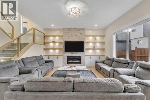 2012 Waterbury Road, Chestermere, AB - Indoor Photo Showing Living Room With Fireplace