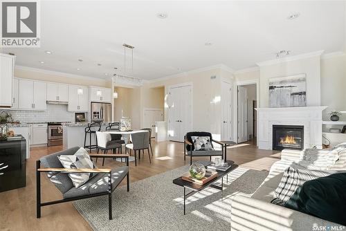 32 115 Meadows Boulevard, Saskatoon, SK - Indoor Photo Showing Living Room With Fireplace