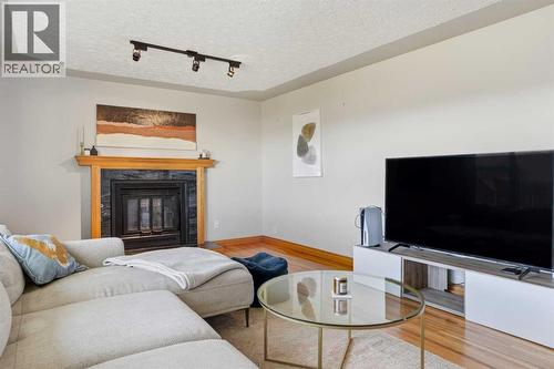 3003 25 Street Sw, Calgary, AB - Indoor Photo Showing Living Room With Fireplace
