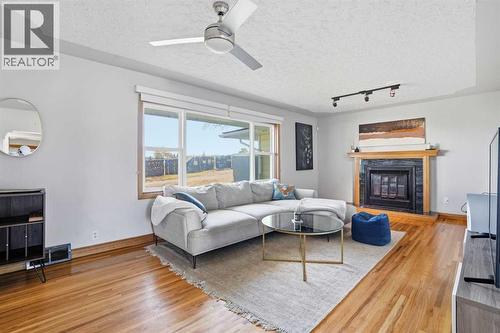 3003 25 Street Sw, Calgary, AB - Indoor Photo Showing Living Room With Fireplace