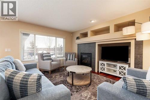 443 Everbrook Way Sw, Calgary, AB - Indoor Photo Showing Living Room With Fireplace