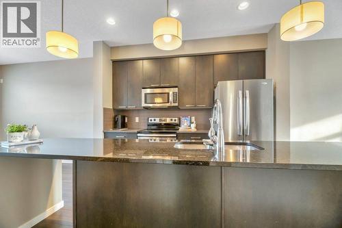 15 Copperpond Close Se, Calgary, AB - Indoor Photo Showing Kitchen With Stainless Steel Kitchen With Upgraded Kitchen