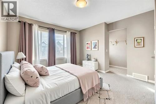 15 Copperpond Close Se, Calgary, AB - Indoor Photo Showing Bedroom