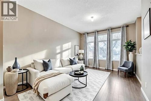 15 Copperpond Close Se, Calgary, AB - Indoor Photo Showing Living Room