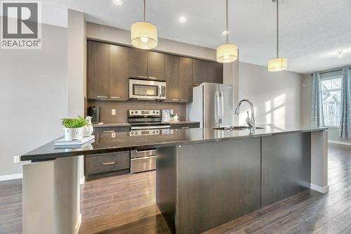 15 Copperpond Close Se, Calgary, AB - Indoor Photo Showing Kitchen With Stainless Steel Kitchen With Upgraded Kitchen