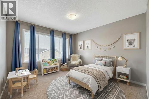 15 Copperpond Close Se, Calgary, AB - Indoor Photo Showing Bedroom