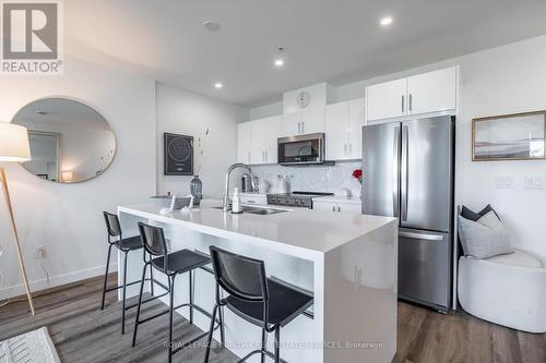 306 - 455 Charlton Avenue E, Hamilton, ON - Indoor Photo Showing Kitchen With Stainless Steel Kitchen With Double Sink With Upgraded Kitchen