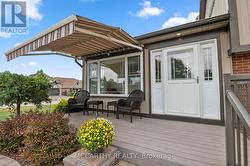 motorized awning over front patio entrance - 