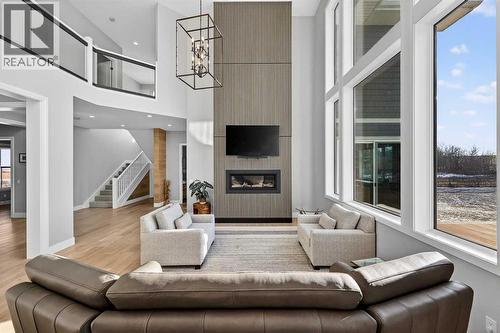402017 23 Street W, Rural Foothills County, AB - Indoor Photo Showing Living Room With Fireplace