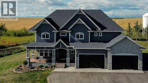 402017 23 Street W, Rural Foothills County, AB - Outdoor With Deck Patio Veranda With Facade