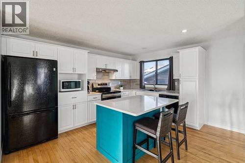 Updated kitchen - 14 Glenhill Crescent, Cochrane, AB - Indoor Photo Showing Kitchen