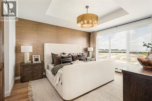 205, 10 Cascade Ridge, Canmore, AB - Indoor Photo Showing Bedroom