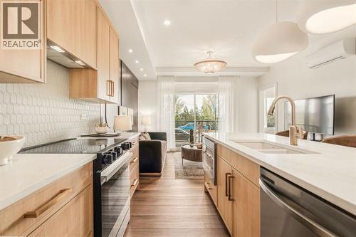 118, 20 Cascade Ridge, Canmore, AB - Indoor Photo Showing Kitchen With Double Sink With Upgraded Kitchen