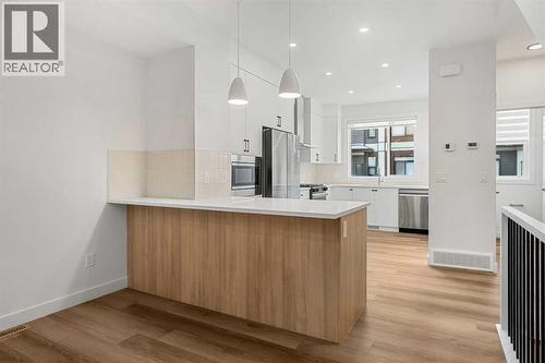 203, 550 Seton Circle Se, Calgary, AB - Indoor Photo Showing Kitchen With Upgraded Kitchen