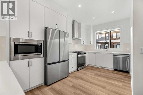 203, 550 Seton Circle Se, Calgary, AB - Indoor Photo Showing Kitchen With Upgraded Kitchen