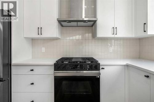 203, 550 Seton Circle Se, Calgary, AB - Indoor Photo Showing Kitchen