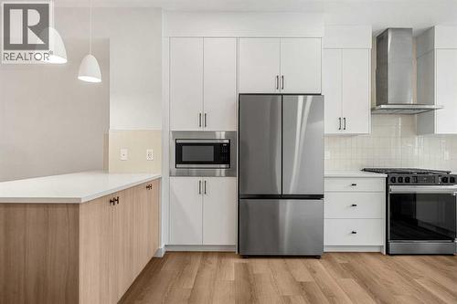 203, 550 Seton Circle Se, Calgary, AB - Indoor Photo Showing Kitchen With Upgraded Kitchen