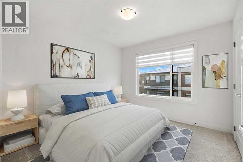 203, 550 Seton Circle Se, Calgary, AB - Indoor Photo Showing Bedroom