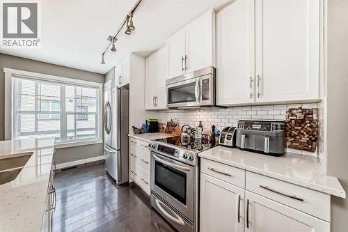 105 Mckenzie Towne Square Se, Calgary, AB - Indoor Photo Showing Kitchen With Stainless Steel Kitchen With Upgraded Kitchen