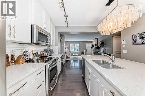 105 Mckenzie Towne Square Se, Calgary, AB - Indoor Photo Showing Kitchen With Double Sink With Upgraded Kitchen