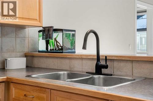 2207, 1888 Signature Park Sw, Calgary, AB - Indoor Photo Showing Kitchen With Double Sink