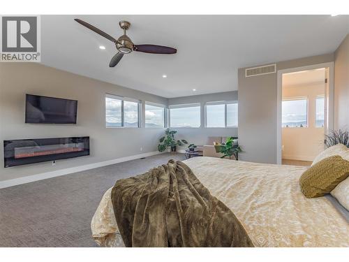 1648 Fawn Run Drive, Kelowna, BC - Indoor Photo Showing Bedroom With Fireplace