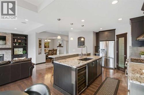 71 Panatella View Nw, Calgary, AB - Indoor Photo Showing Kitchen With Fireplace With Upgraded Kitchen