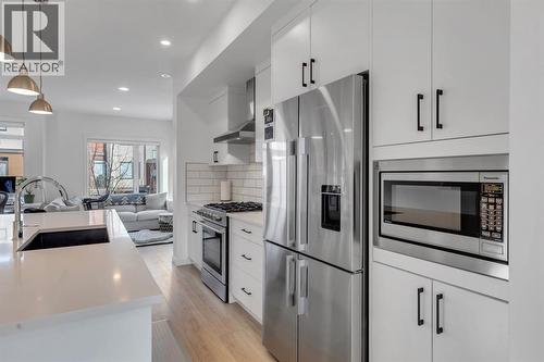 Upgraded Builder Gourmet Kitchen Package - 213 Greenbriar Common Nw, Calgary, AB - Indoor Photo Showing Kitchen With Stainless Steel Kitchen With Upgraded Kitchen
