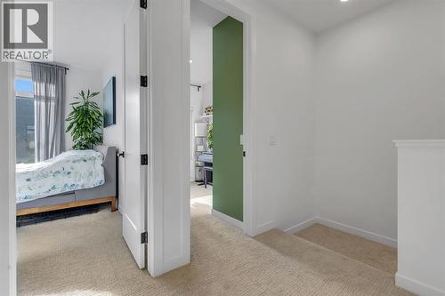 Landing - 213 Greenbriar Common Nw, Calgary, AB - Indoor Photo Showing Other Room