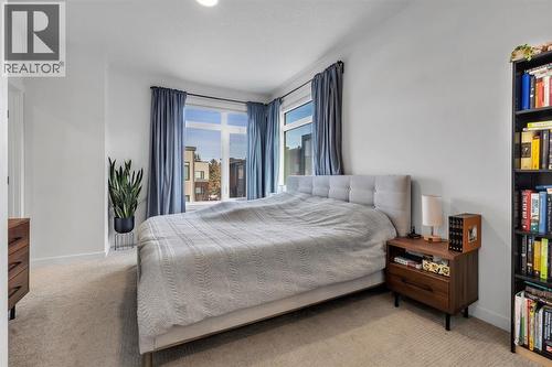 Primary Bedroom Overiszed - 213 Greenbriar Common Nw, Calgary, AB - Indoor Photo Showing Bedroom