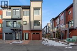 Rear Showcasing Garage and Driveway - 