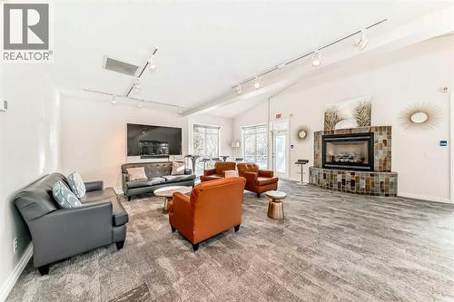 3217, 24 Hemlock Crescent Sw, Calgary, AB - Indoor Photo Showing Living Room With Fireplace