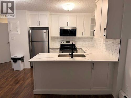 121, 1237 4 Avenue S, Lethbridge, AB - Indoor Photo Showing Kitchen With Stainless Steel Kitchen