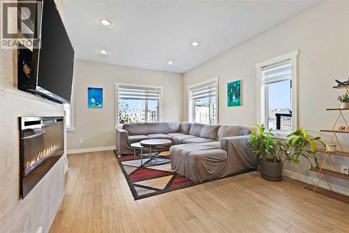 357 Sage Hill Circle Nw, Calgary, AB - Indoor Photo Showing Living Room With Fireplace