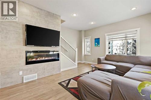357 Sage Hill Circle Nw, Calgary, AB - Indoor Photo Showing Living Room With Fireplace