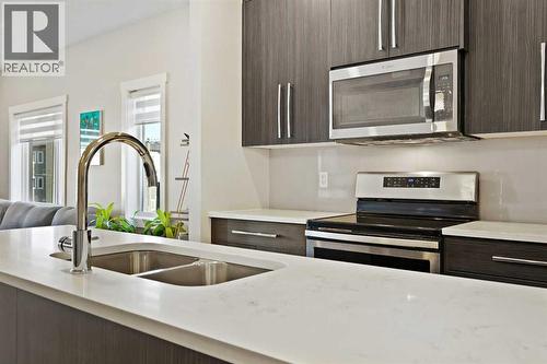 357 Sage Hill Circle Nw, Calgary, AB - Indoor Photo Showing Kitchen With Double Sink