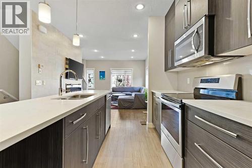 357 Sage Hill Circle Nw, Calgary, AB - Indoor Photo Showing Kitchen With Stainless Steel Kitchen With Double Sink With Upgraded Kitchen
