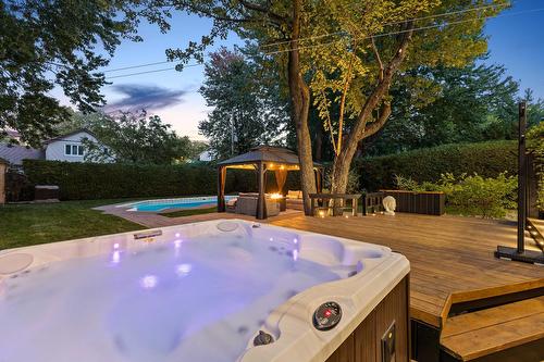 Hot tub - 1130 Rue Goyer, Saint-Bruno-De-Montarville, QC - Outdoor With Backyard