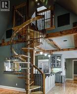 Stairway with wood finished floors and baseboards - 