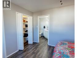 Primary bedroom with a small walk in closet and a standard closet - 