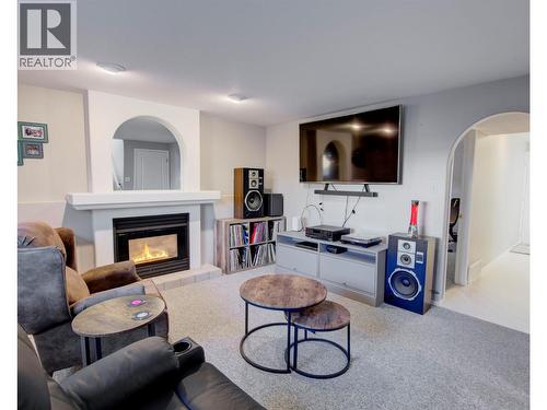 Family room - lower level - 2312 Hunter Avenue, Armstrong, BC - Indoor Photo Showing Living Room With Fireplace