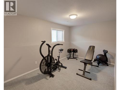 4th Bedroom on lower level with closets - 2312 Hunter Avenue, Armstrong, BC - Indoor Photo Showing Gym Room