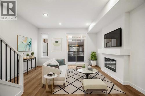 202, 550 Seton Circle Se, Calgary, AB - Indoor Photo Showing Living Room With Fireplace