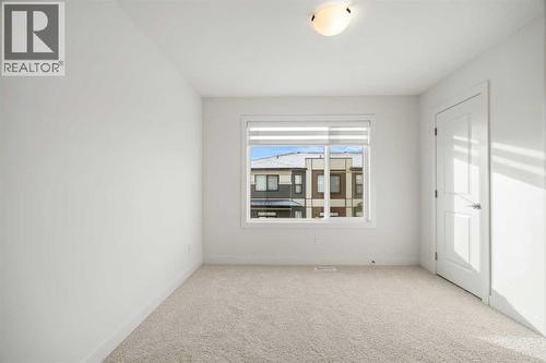 202, 550 Seton Circle Se, Calgary, AB - Indoor Photo Showing Other Room