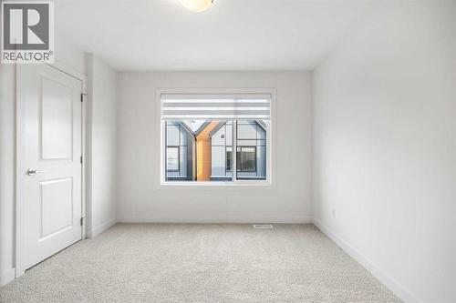 202, 550 Seton Circle Se, Calgary, AB - Indoor Photo Showing Other Room