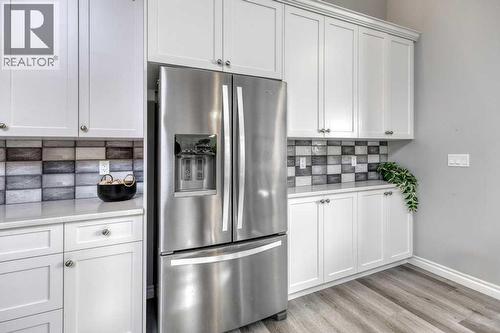 380 Rivercrest View, Cochrane, AB - Indoor Photo Showing Kitchen With Stainless Steel Kitchen