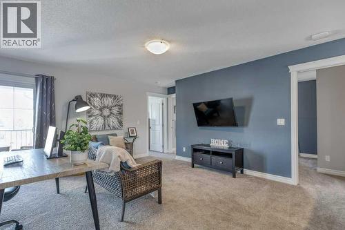 380 Rivercrest View, Cochrane, AB - Indoor Photo Showing Living Room