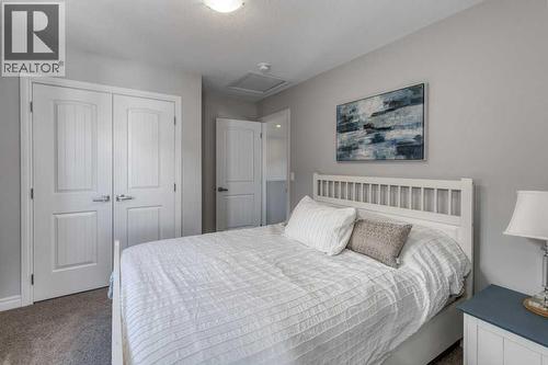 380 Rivercrest View, Cochrane, AB - Indoor Photo Showing Bedroom